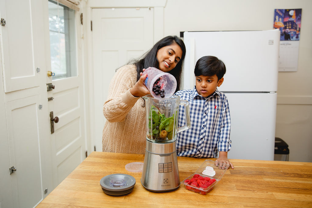 Family making BC Blueberry smoothie. Photo credit to Rhonda Dent Photography.