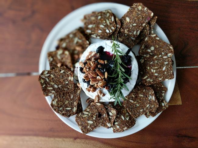 cheese and cracker plate with blueberry compote