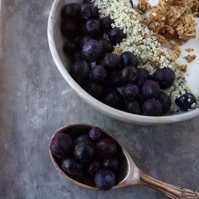 frozen blueberries on yogurt